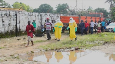 Video grab of health workers surround an Ebola patient who escaped from quarantine from Monrovia's Elwa hospital, in the centre of Paynesville