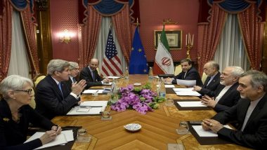 Wendy Sherman, John Kerry, Ernest Moniz, Robert Malley, Abbas Araghchi, Ali Akbar Salehi, Javad Zarif and Hossein Fereydoon wait to start  a meeting at the Beau Rivage Palace Hotel in Lausanne